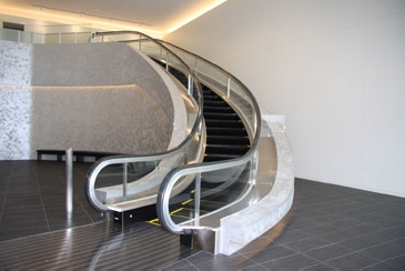 A spiral escalator at new training center's entrance